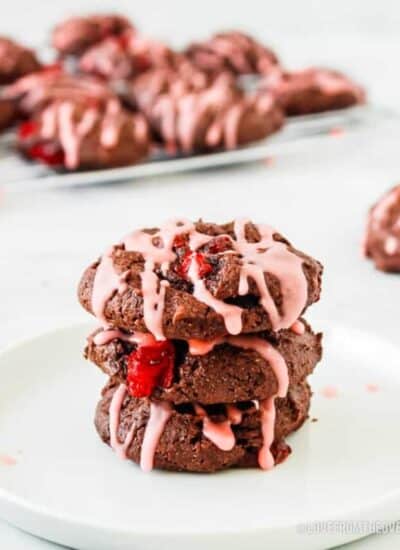 a stack of chocolate cookies with cherries