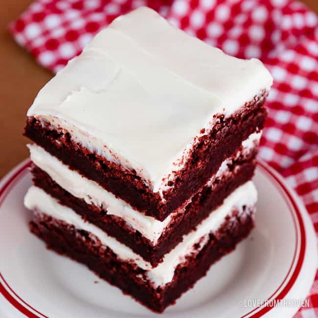 stack of red velvet brownies with cream cheese frosting