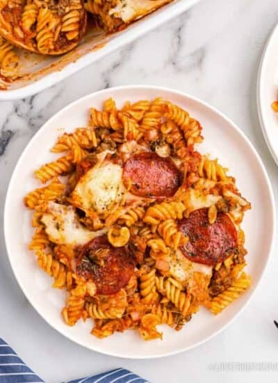 An overhead shot of a plate of pizza pasta