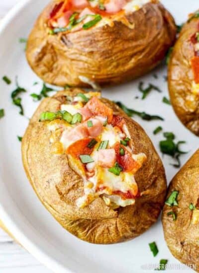 A plate of air fryer baked potatoes with toppings