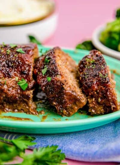 Meatloaf on a green plate.