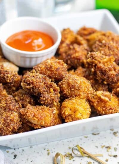 A plate full of popcorn chicken