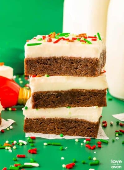 a stack of homemade gingerbread bars with cream cheese frosting