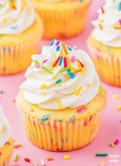 a birthday cupcake on a pink background