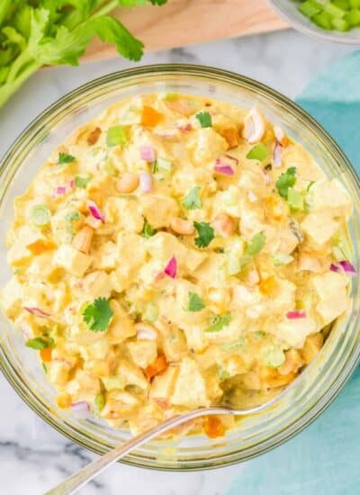 curried chicken salad in a bowl with a spoon