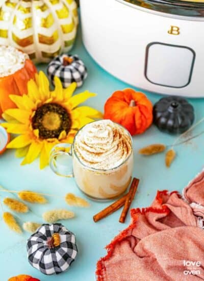 a mug of pumpkin spice latte on a fall decorated table