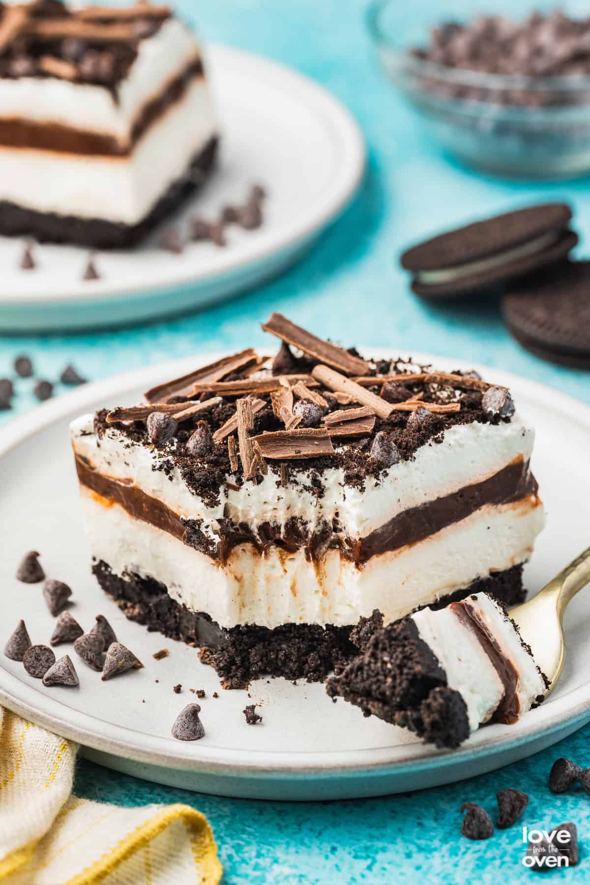 a piece of chocolate lasagna with a bite taken out