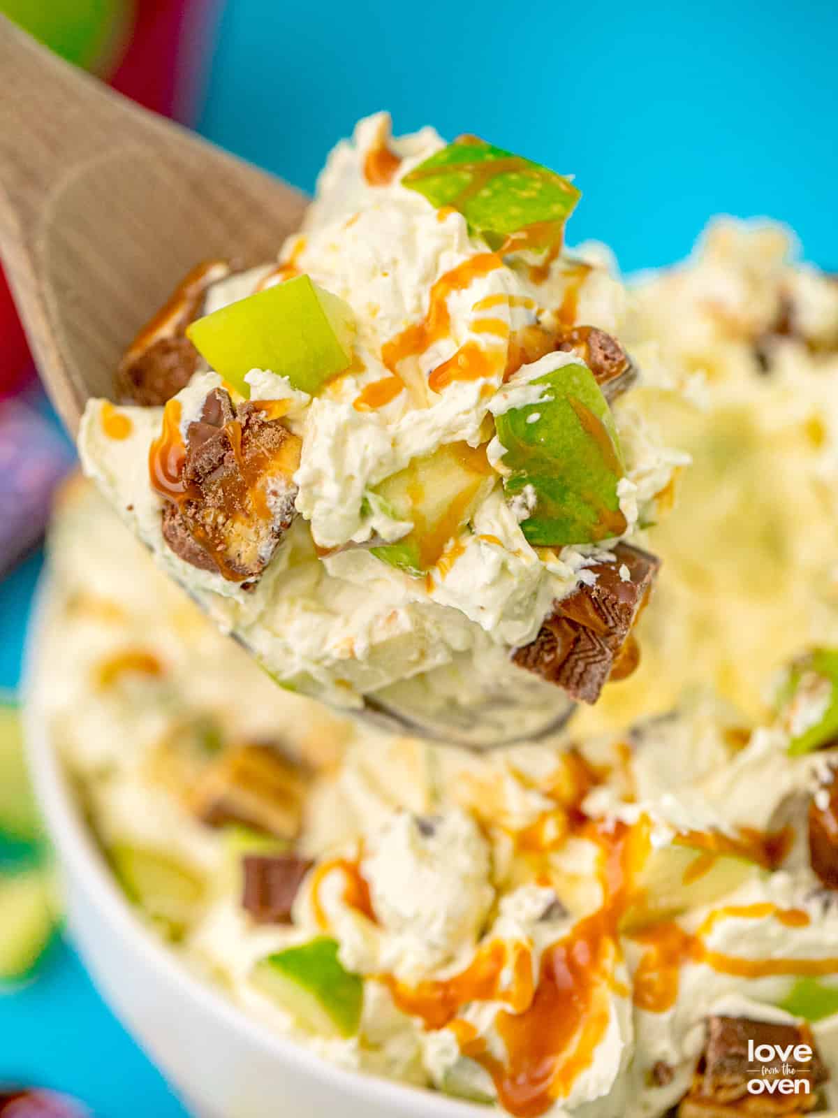 A spoonful of snickers apple salad.