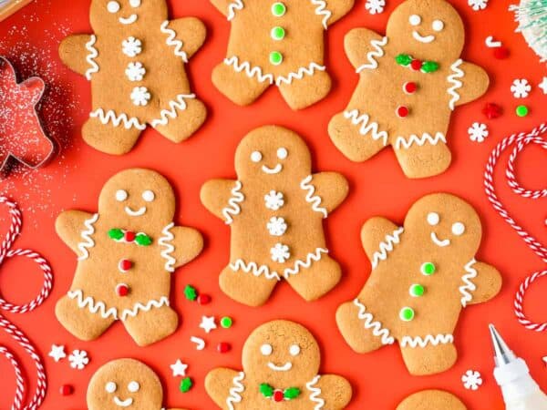 Christmas gingerbread man cookies on a red background.